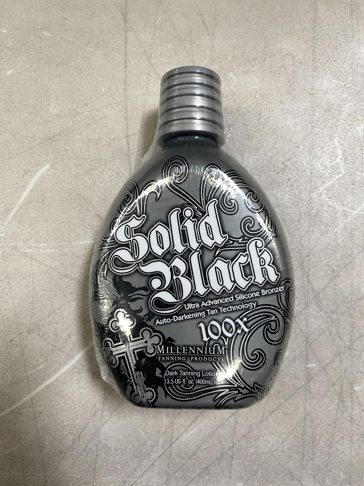 Millennium Tanning SOLID BLACK 100X Dark Tanning Lotion with application gloves