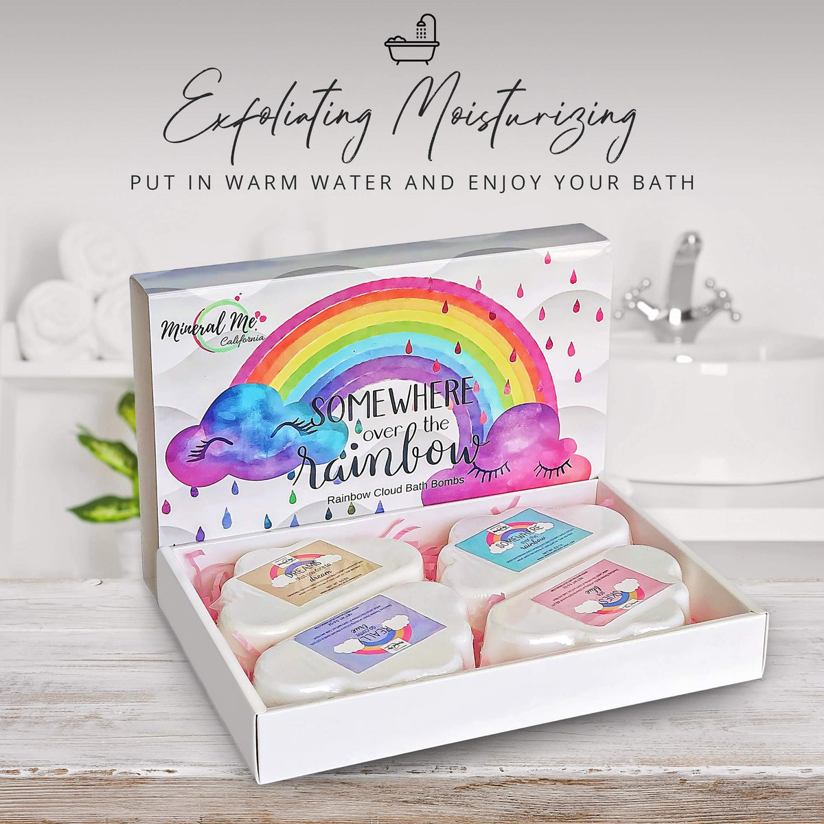 Mineral Me California Rainbow Cloud Bath Bombs being dropped into water
