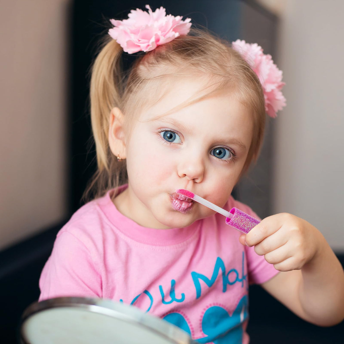 Minnie Mouse Lip Gloss Set displayed on a table with toys