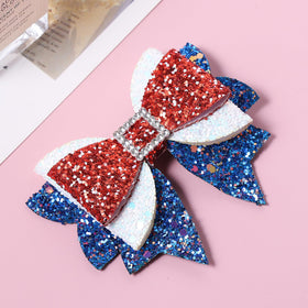 Miroksh 4th of July Hair Bow Clip in hands, highlighting size and design