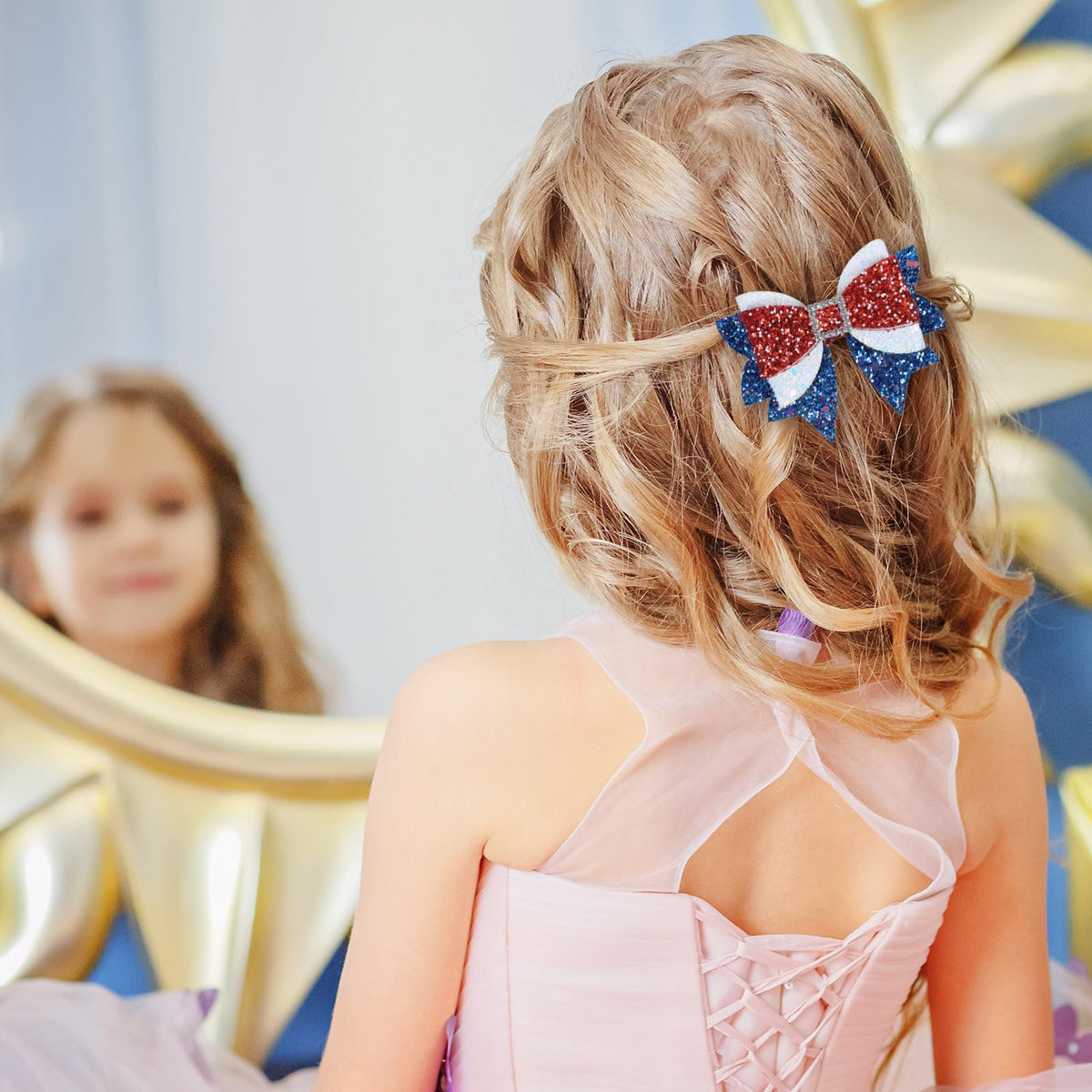 Miroksh 4th of July Hair Bow Clips on a model in a patriotic outfit