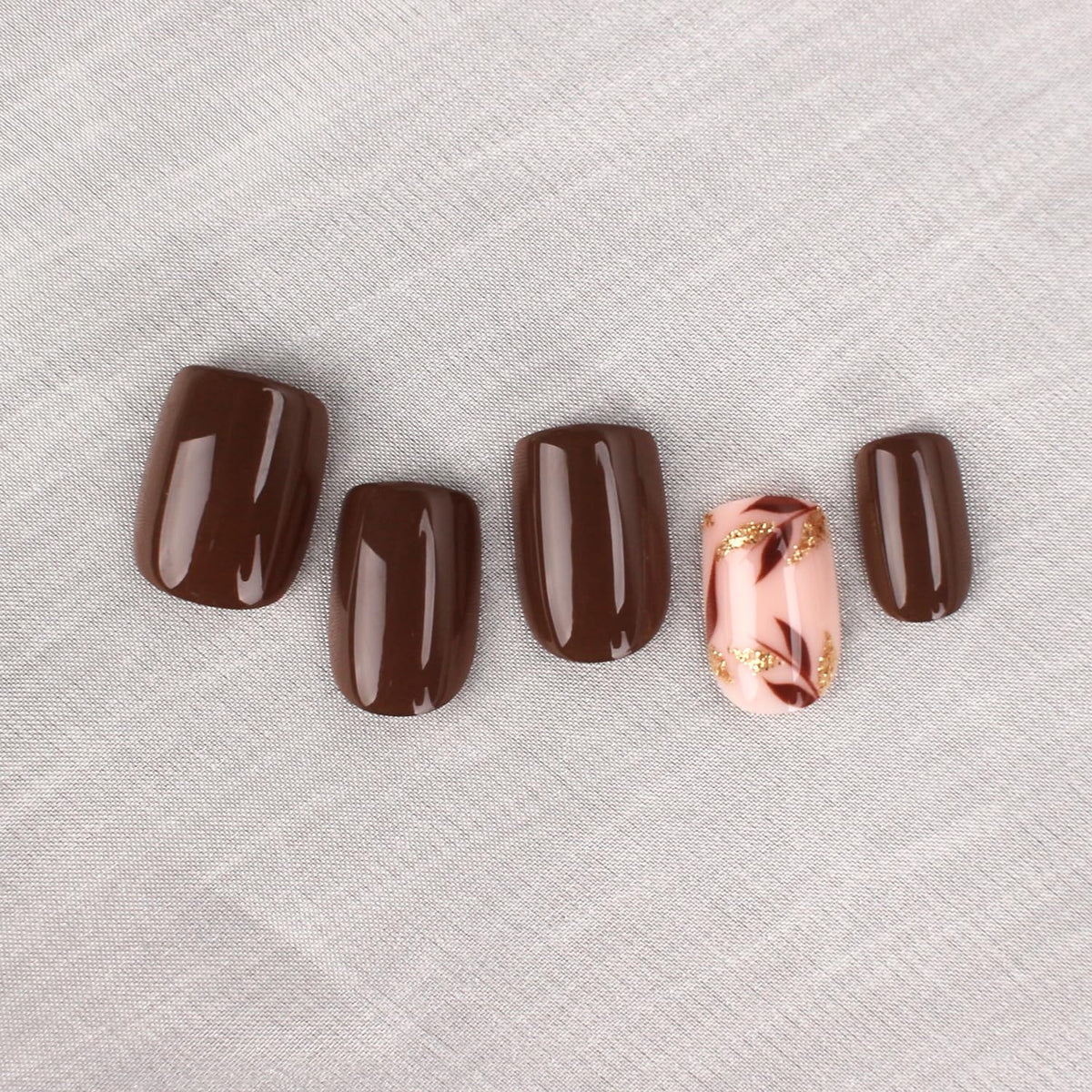Mivota Brown Press On Nails with gold leaf design close-up
