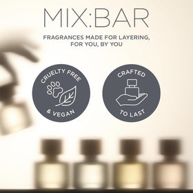 MIX:BAR Sparkling Hibiscus Hair + Body Mist 5oz on a vanity with accessories