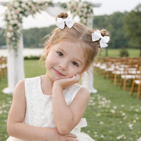 MIXJOY Flower Girl Pearl Hair Clip styled in a toddler's hair