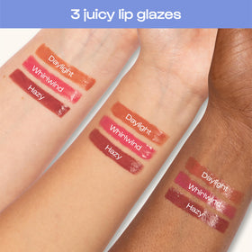 Model applying ALLEYOOP Sun Serum Lip Oil SPF 40 outdoors