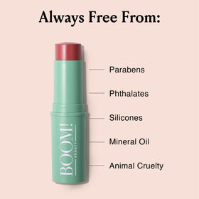 Model applying BOOM! by Cindy Joseph Boomstick Rose Nude cream blush