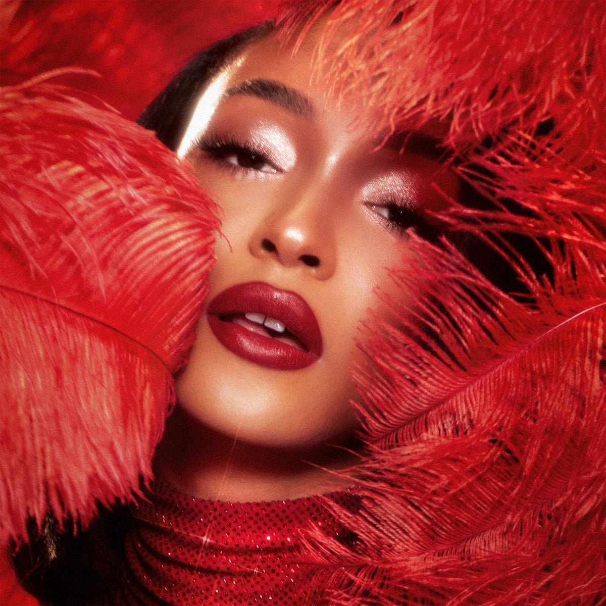 Model applying Charlotte Tilbury Matte Revolution Lipstick