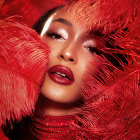 Model applying Charlotte Tilbury Matte Revolution Lipstick