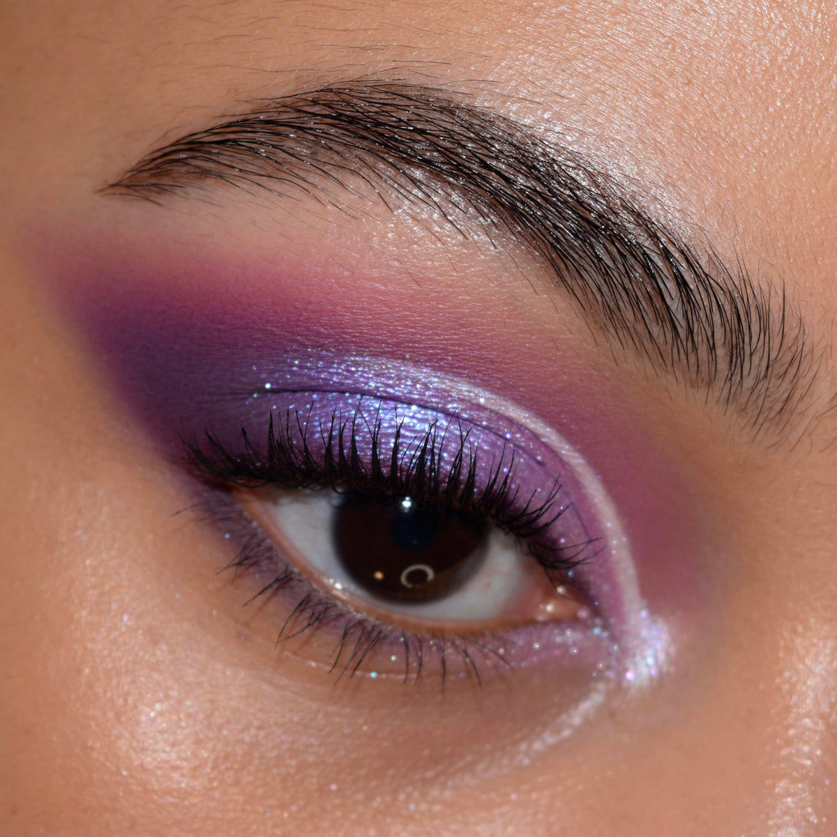 Model applying ColourPop All Amethyst Eyeshadow Palette