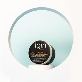Model applying Honey Miracle Hair Mask on wavy hair