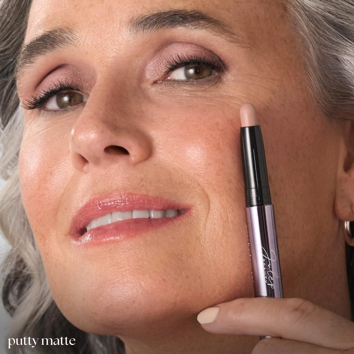 Model applying Julep Eyeshadow 101 Crème-to-Powder Stick