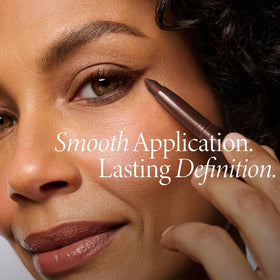 Model applying LAURA GELLER Kajal Longwear Kohl Eyeliner