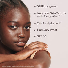 Model applying Laura Mercier Tinted Moisturizer Natural Dewy SPF 30 6N Umber