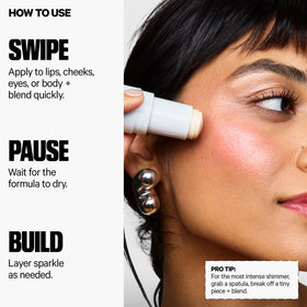 Model applying Milk Makeup Cooling Water Jelly Shimmer Stick on cheeks