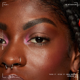 Model applying NYX Thick It Stick It Brow Mascara