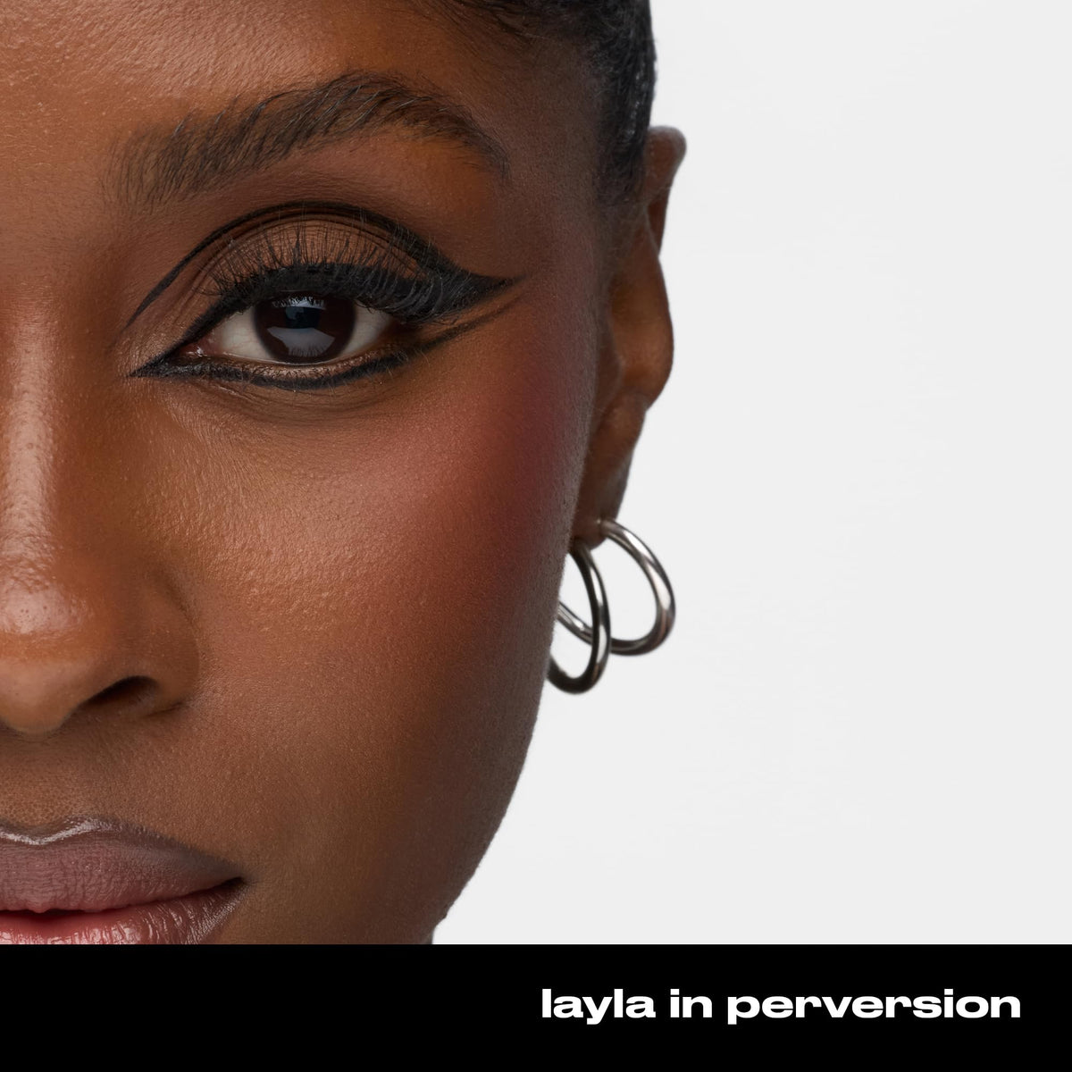 Model applying URBAN DECAY 24/7 Glide-On Waterproof Eyeliner Pencil