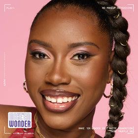 Model wearing NYX Make 'Em Wonder Liquid Foundation 38 Deep Truffle