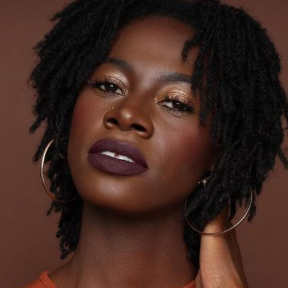 Model wearing The Lip Bar Drama Queen lipstick