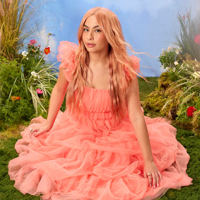 Model with vibrant apricot hair using ARCTIC FOX Apricot Anarchy
