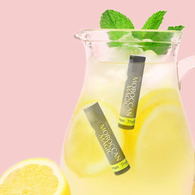 Moroccan Magic Lemon Thyme Lip Balm in lifestyle setting