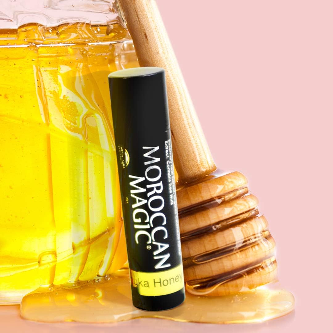 Moroccan Magic Organic Manuka Honey Lip Balm opened with a hand