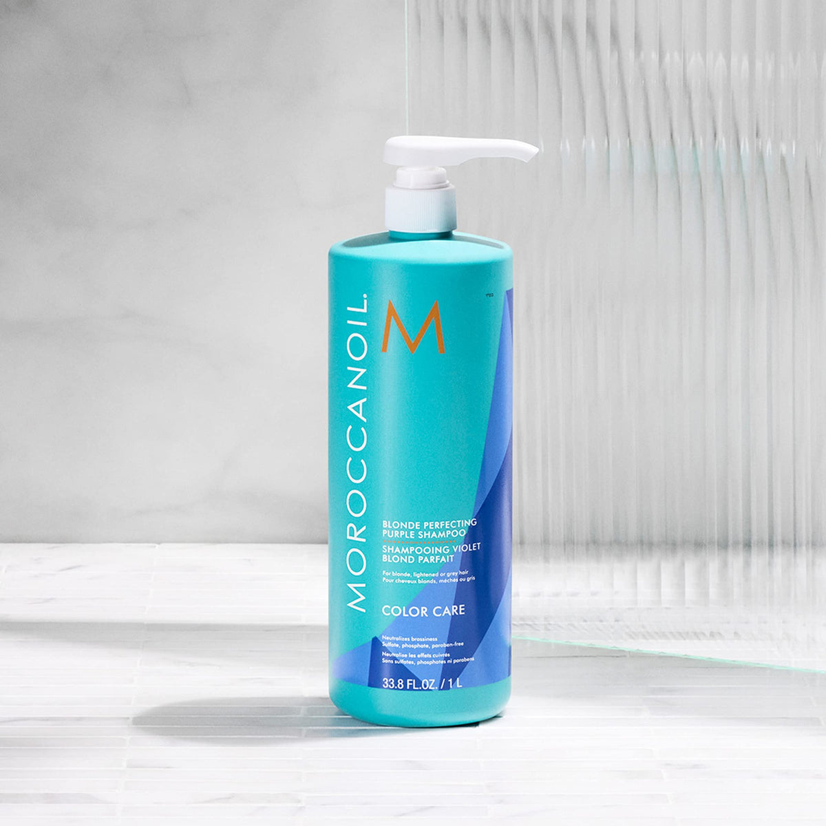 Moroccanoil Blonde Perfecting Purple Shampoo in a bathroom setting