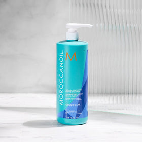 Moroccanoil Blonde Perfecting Purple Shampoo in a bathroom setting
