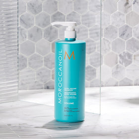 Moroccanoil Extra Volume Shampoo 33.8 Fl. Oz. in bathroom setting