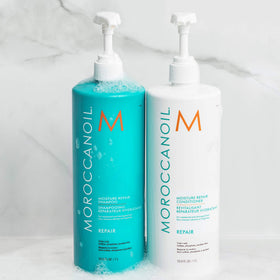 Moroccanoil Moisture Repair Shampoo in bathroom setting