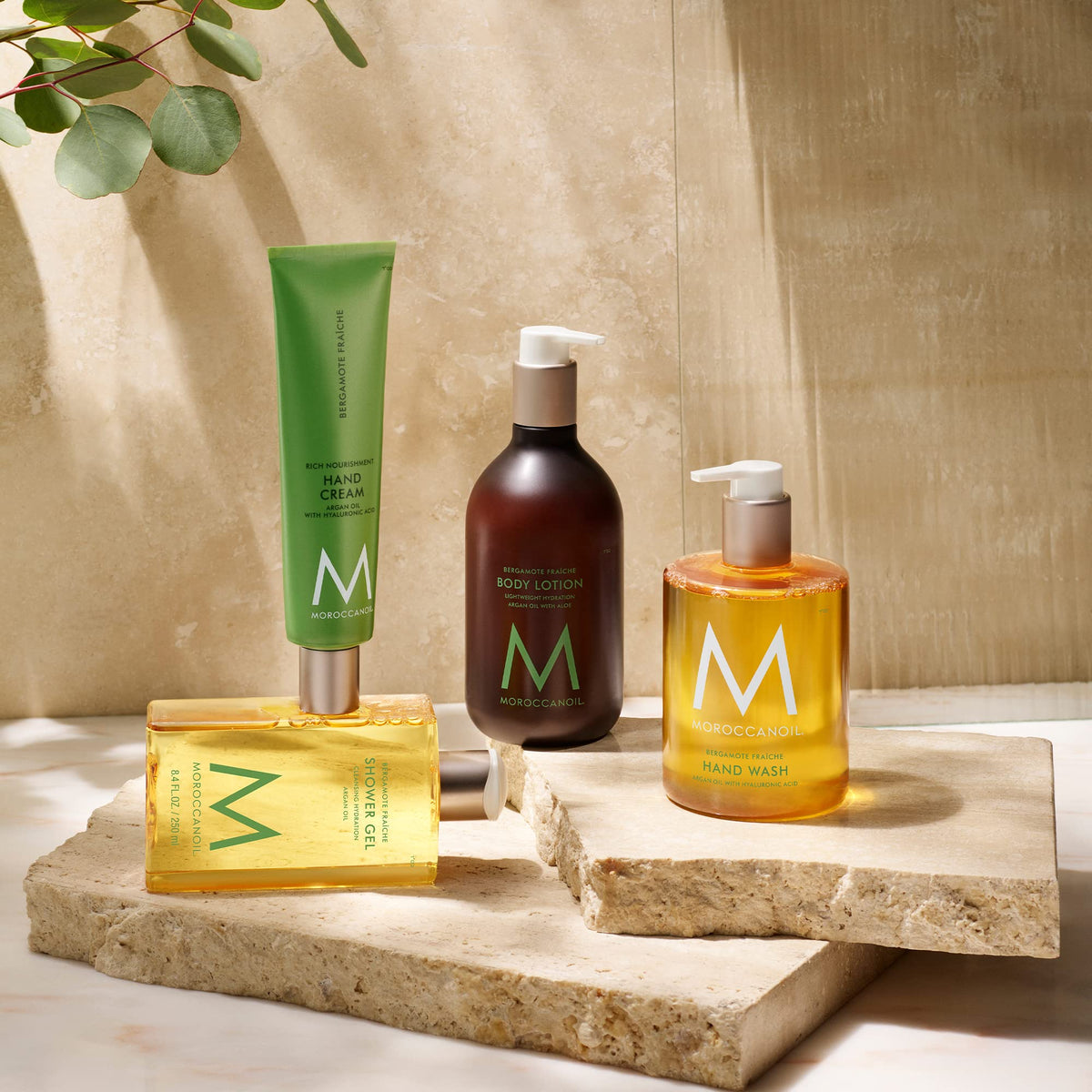 Moroccanoil Shower Gel Bergamote Fraiche surrounded by mint leaves