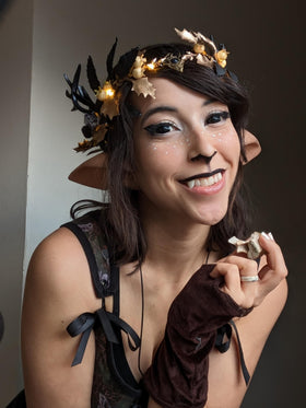 MOSTORY Light Up Antler Crown worn by a model at a Renaissance fair