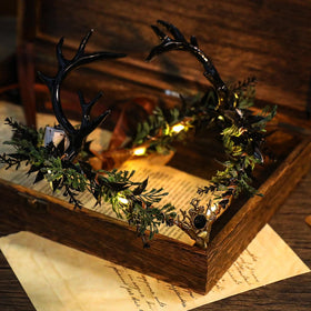 MOSTORY Light Up Elf Crown displayed on a table