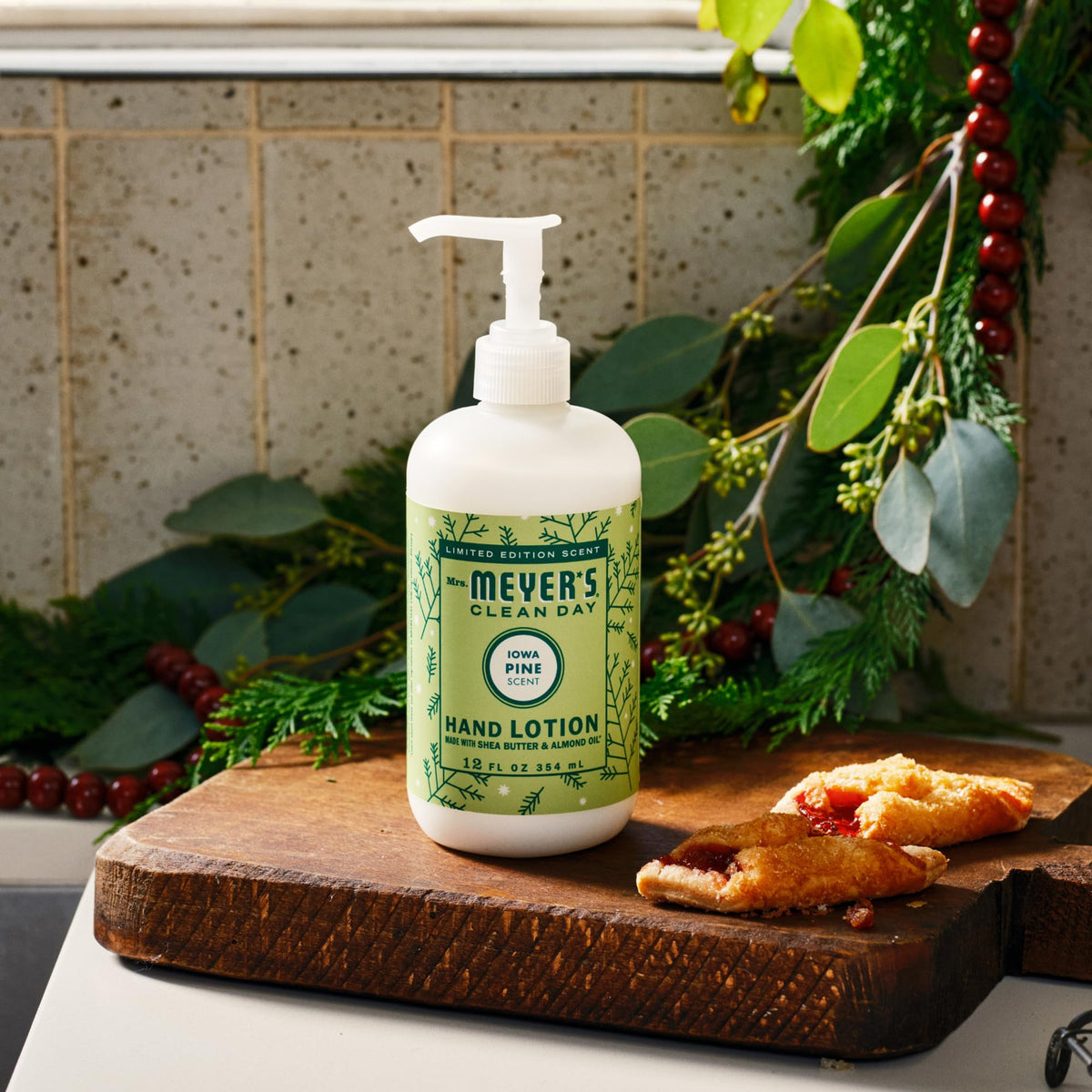 Mrs. MEYER'S Iowa Pine Hand Lotion on a wooden table