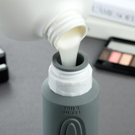 Mrsdry Travel Bottles being filled with shampoo