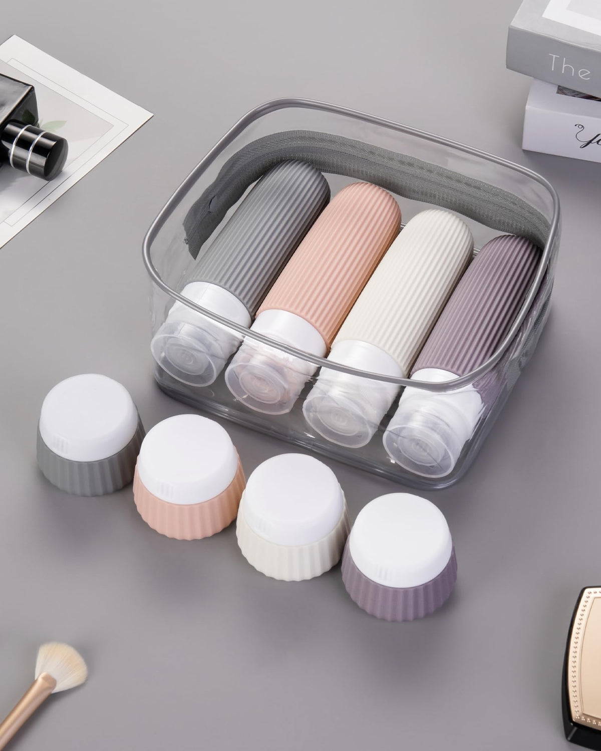 Mrsdry travel bottles set displayed on a travel suitcase