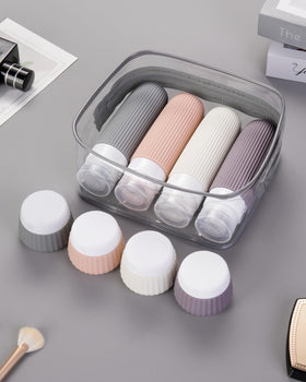 Mrsdry travel bottles set displayed on a travel suitcase