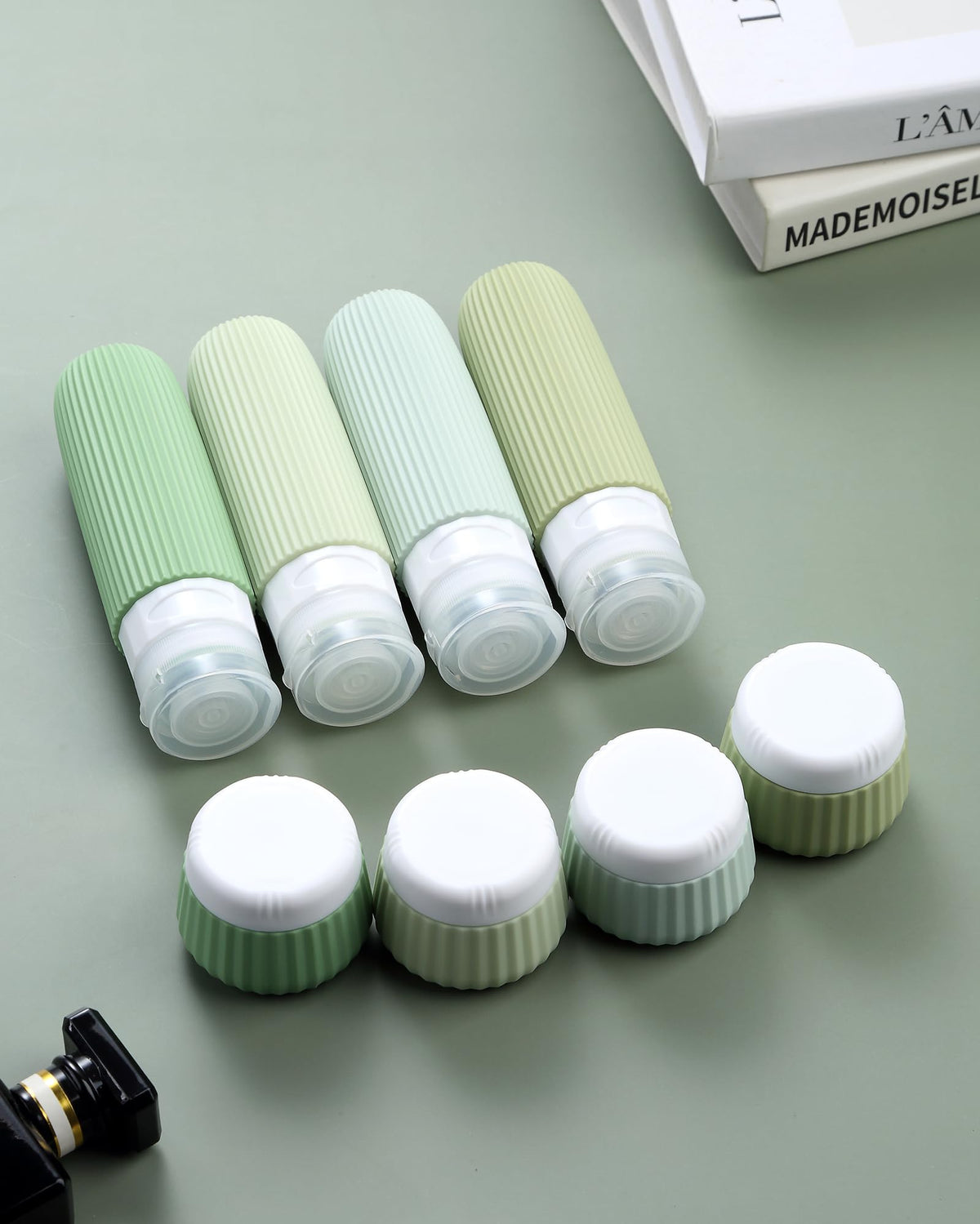 Mrsdry travel bottles set displayed on a travel suitcase
