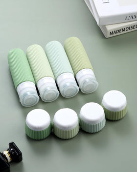 Mrsdry travel bottles set displayed on a travel suitcase