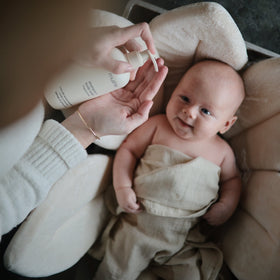 mushie Baby Shampoo & Body Wash in bath setting