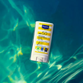 Mustela Baby Mineral Sunscreen Stick SPF 50 in hand
