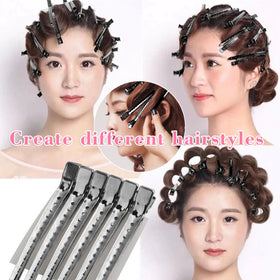 Mythos hair clips in use while styling hair