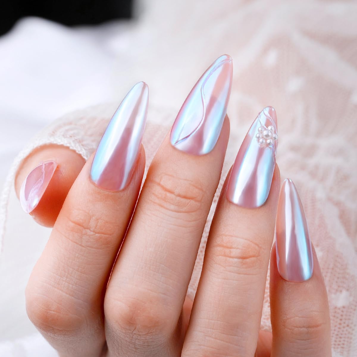 Nails decorated with Pretty Diva Moonlight Chrome Nail Powder in a salon setting