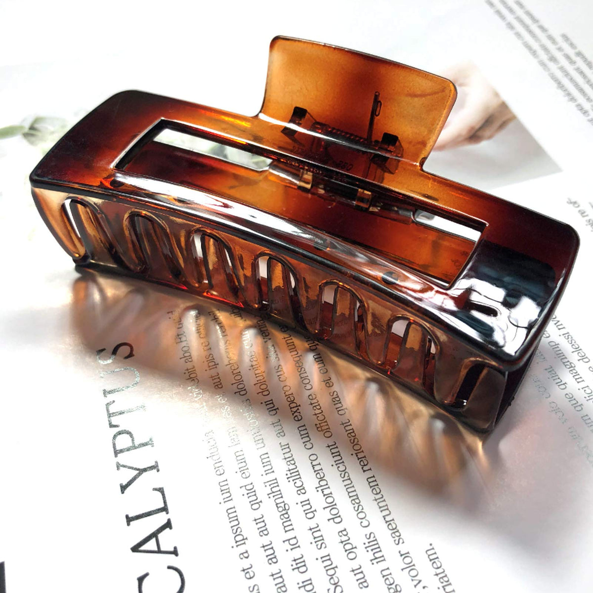 Nalodu Hair Claw Clip in glossy caramel side view