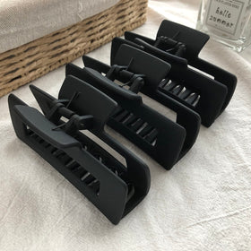 Nalodu Hair Claw Clips 3 pack displayed on a vanity