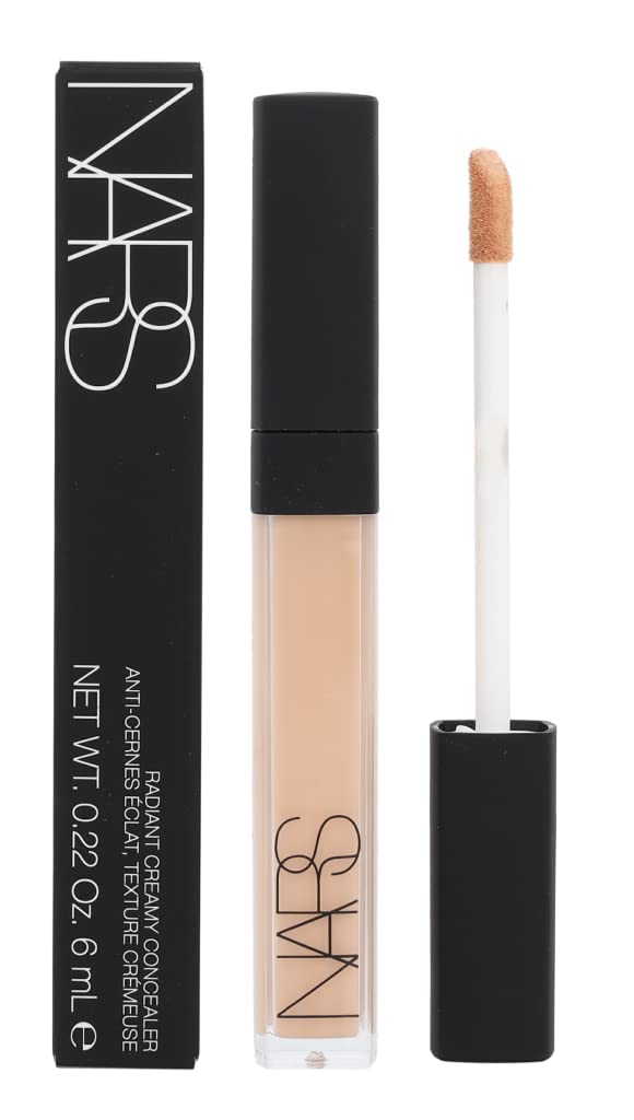 NARS Radiant Creamy Concealer No. 2.75 Cannelle on vanity with makeup tools