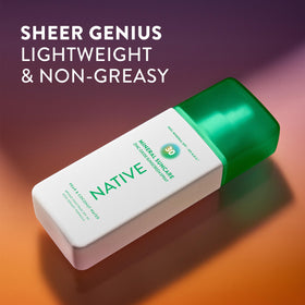 Native Mineral Sunscreen Spray SPF 30 in hand with visible spray