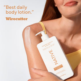 Native Moisturizing Body Lotion with a towel and flowers