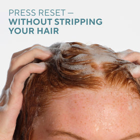 Native Strengthening Shampoo Cashmere & Rain on bathroom shelf