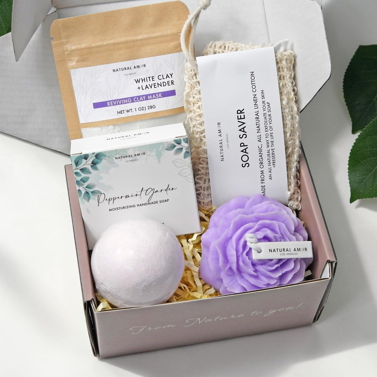 NATURAL AMOR bath bomb in a bath setting