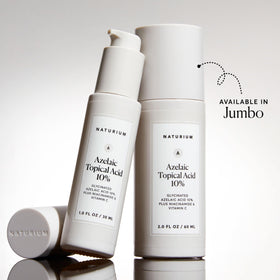 Naturium Azelaic Acid Serum in hand with a dropper